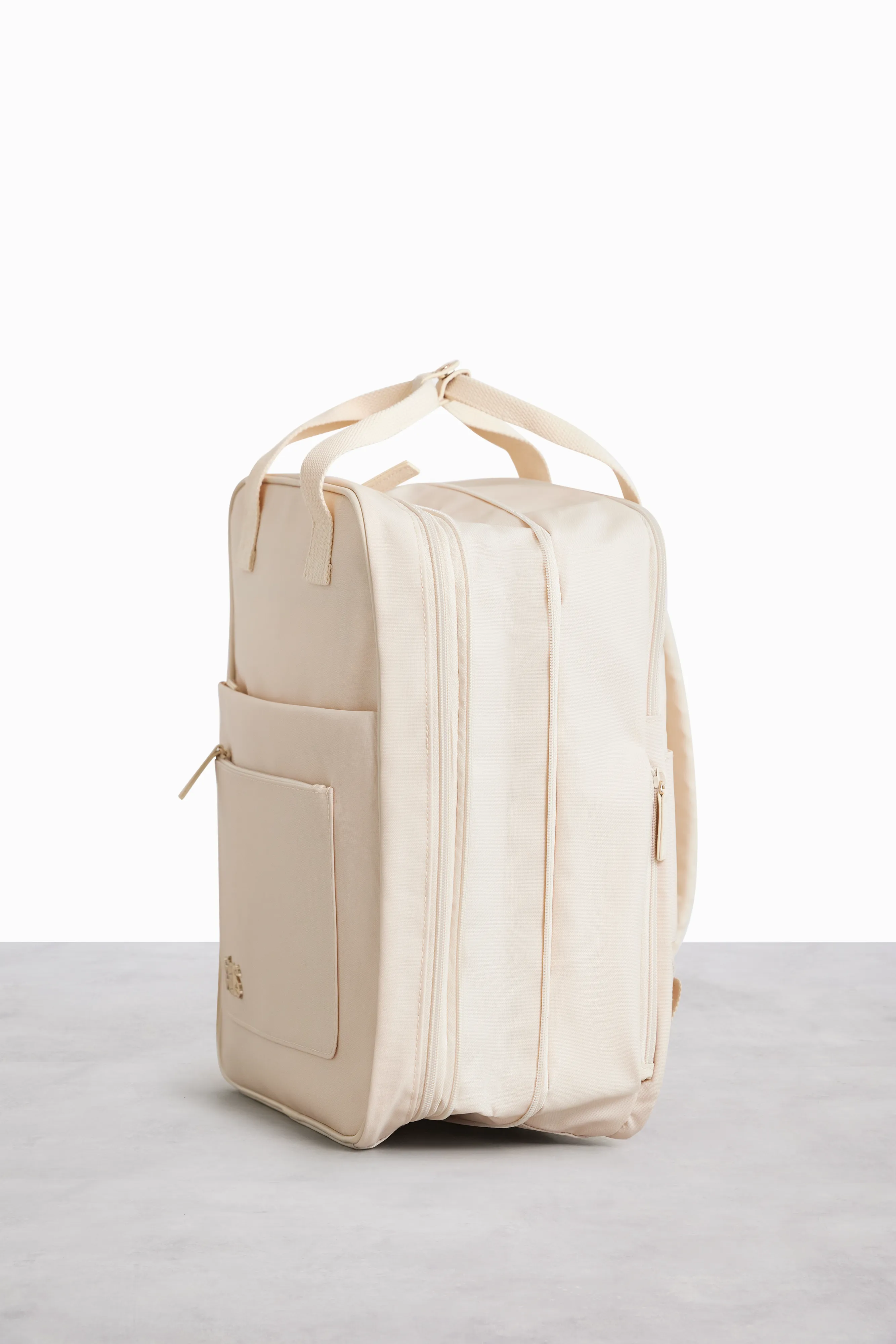 The Expandable Backpack in Beige